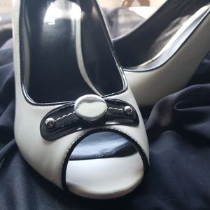 Black and cream peep toe pumps